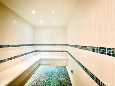 a swimming pool in a bathroom with a tiled floor at Vogue Business Bay, Bayz By Danube close to Downtown, Dubai Mall and Burj Khalifa, Three Bedroom Apartment with Balcony and Burj Khalifa view, Access to all Amenities in Dubai