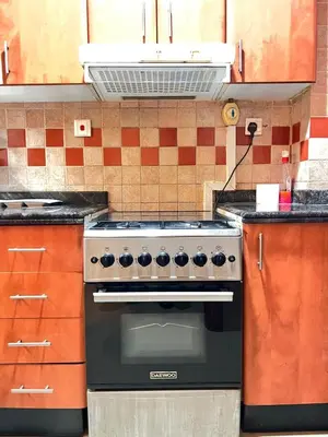 a kitchen with a stove top oven in a kitchen at Dream Tower 1 in Dubai