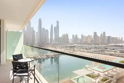 a balcony with a view of a city at Silkhaus Marina View with Tower's Private Beach in Dubai