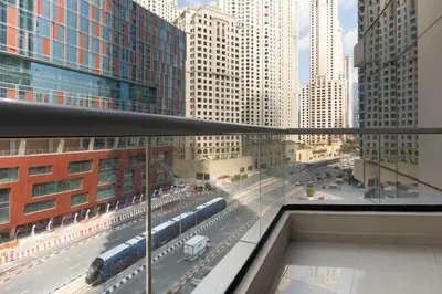 a view of a street with a train in a city at GuestReady - Comfort Stay l Close To Marina Mall in Dubai