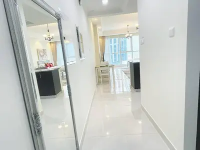 a mirror in a living room with a kitchen at RH- Beautiful Canal View, Cozy studio near metro station in Dubai