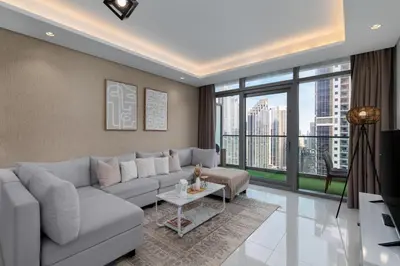 a living room with a couch and a table at Burj Khalifa Views 2BR with Infinity Pool Downtown in Dubai