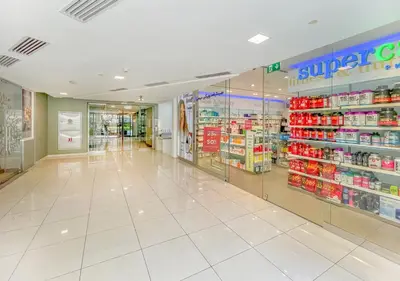 an empty store aisle in a store at Luxury 1BR Apartment in the heart Marina, Connection to Dubai Marina Mall - Silverene tower in Dubai