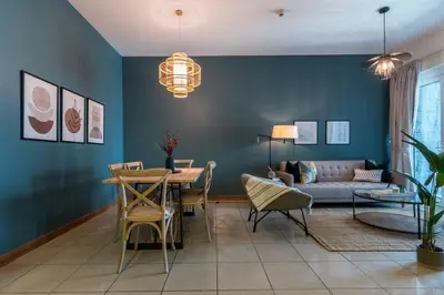 a living room with a couch and a table at GuestReady - The Reflections at Dubai Marina in Dubai