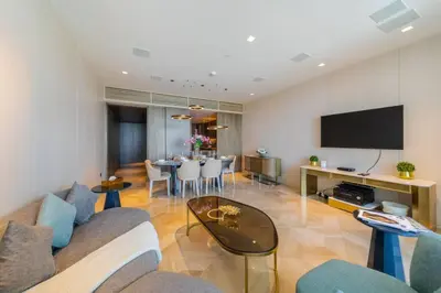 a living room with a couch and a table at *Five Palm* 2bdr Private Beach in Dubai