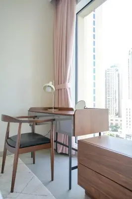 a desk and chair in a room with a window at Your Elegance at Creek Harbour l 2BR in Dubai