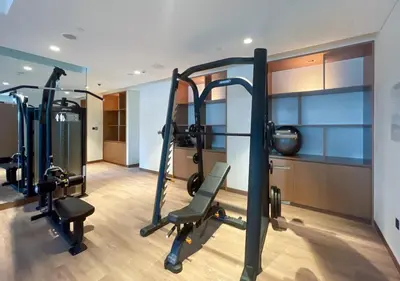 a gym with two tread machines in a room at Lux 1 BD Apartment, 2 Min walk to Dubai Mall & Burj Khalifa - Act One Tower in Dubai