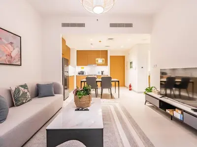 a living room with a couch and a table at Zen Oasis : 1BR Splendid Creek Side Retreat - Beach in Dubai