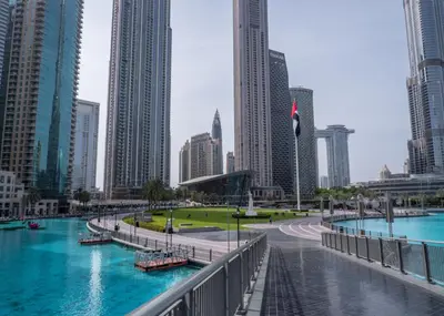 a river in a city with tall buildings at HAVN - Studio Unit in 8 Boulevard, Downtown Dubai in Dubai