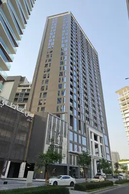 a tall building with a car parked in front of it at HAVN - Studio Unit in 15 Northside, Business Bay in Dubai