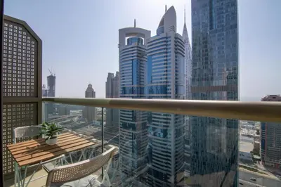 a view of a city from the balcony of a skyscraper at GuestReady- Holiday Homes - Cyan Sky View in Dubai