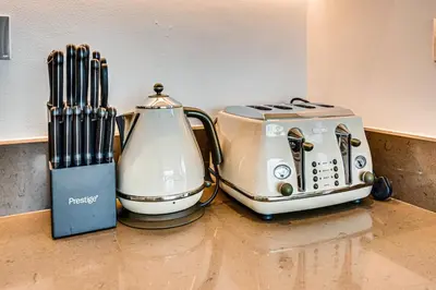 two toasters sitting on top of a kitchen counter at Luxurious apartment in Dubai Marina in Dubai