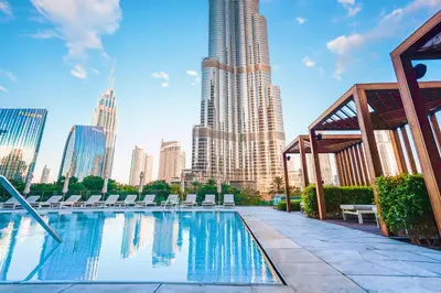 a swimming pool with a view of a tall building at THE CLOSEST building to Burj Khalifa with Fountain View in Address Opera Residence in Dubai