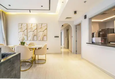 a dining room with a table and chairs at New Arabian Shams 2 JBR Sea View in Dubai