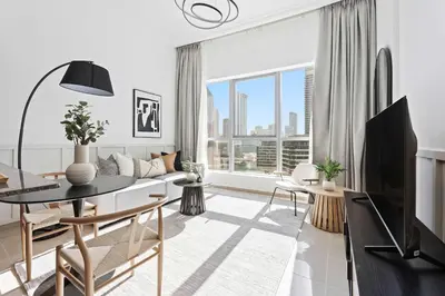 a living room with a couch and a table with a tv at Silkhaus in Dubai Marina Heart, Opposite to Marina Mall in Dubai