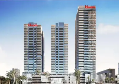 three tall skyscrapers in a city with palm trees at HAVN - 2 Bedroom Apartment in Bloom Tower, JVC in Dubai