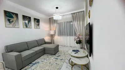 a living room with a couch and a table at Stay in heart of Dubai Marina, walk to JBR! #3 in Dubai