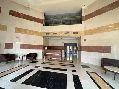 a lobby with couches and chairs in a building at Diomond view 4 in Dubai