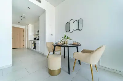 a dining room with a table and chairs at Frank Porter - Marquise Square Tower in Dubai
