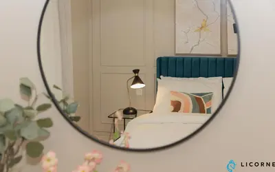 a mirror reflection of a bed in a bedroom at Prime Spacious 2 BR Apt, Burj Khalifa & Canal View - Scala Tower in Dubai