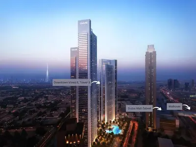 a city skyline with tall skyscrapers at night at Brand New Modern 2BR Retreat, Walk to Dubai Mall - Downtown Views ll in Dubai