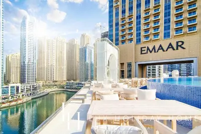 a hotel rooftop with a view of a city at LUX The JW Marina Studio in Dubai