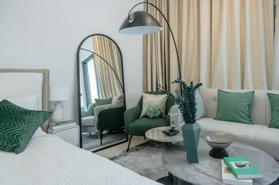 a living room with a bed and a mirror at Clever Guest 014 Binghatti Canal in Dubai
