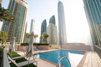 a pool in the middle of a city with tall buildings at Forte Tower 1 - Fantastic Two Bedroom in Downtown Dubai in Dubai