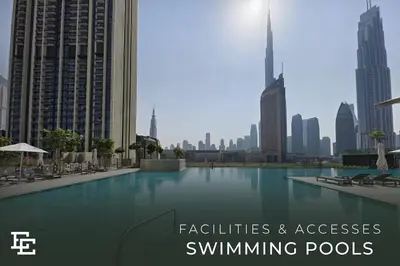 a swimming pool in the middle of a city at Elite Escape Holiday Home - 2 BHK Getaway with Burj Khalifa View and Dubai Mall Access - 1504 in Dubai