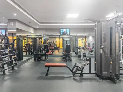 a gym with lots of equipment in a room at StoneTree - Cozy Studio - JLT in Dubai