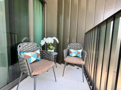 two chairs and a table on a balcony at Розкішна квартира з видом на Бурж Халіфа in Dubai