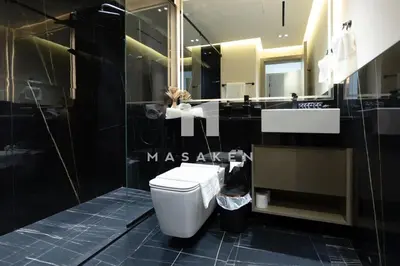 a bathroom with a toilet and a sink at Stylish 1br Business Bay W Burj Views in Dubai