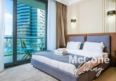 a bedroom with a bed and a large window at Classic 1 Bed Suite in Burj Vista Tower, Downtown in Dubai