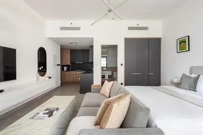 a living room with a large bed and a couch at Frank Porter - DT1 Tower in Dubai