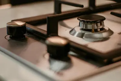 a close up of a stove top withustedobs on it at Modern Oasis: Spacious Studio Near Dubai Downtown in Dubai