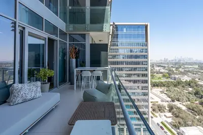 an apartment balcony with a view of a city at Burj Daman, DIFC Dubai - Mint Stay in Dubai