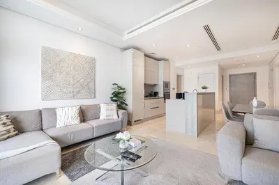 a living room with a couch and a table at 2BR with Sea View & Terrace in Dubai