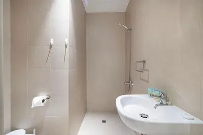 a bathroom with a sink and a shower and a toilet at 2BR with Sea View & Terrace in Dubai