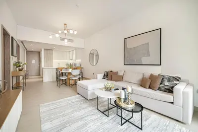 a living room with a white couch and a table at Sophisticated 1 Bed Suite in Dubai Marina in Dubai