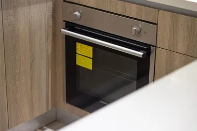 a oven with a yellow sticky note on it at Sophisticated 1 Bed Suite in Dubai Marina in Dubai