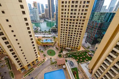 an aerial view of a city with tall buildings at Upgraded 3BR Jacuzzi & Comfort at JBR in Dubai