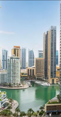 a view of a city with a river and buildings at Upgraded 3BR Jacuzzi & Comfort at JBR in Dubai