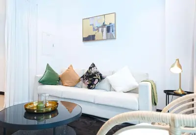 a living room with a couch and a table at EasyGo - Northside Tower 2 Canal View in Dubai