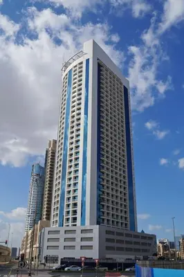 a tall building with blue and white at HAVN - Studio in Downtown, Near Dubai Mall in Dubai