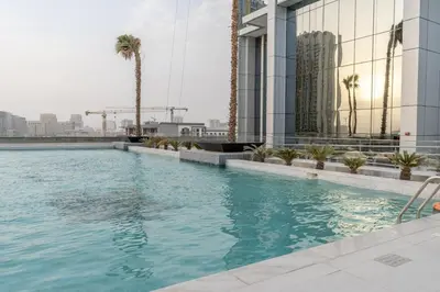 a swimming pool on the roof of a building at GuestReady Holiday Homes - Arabian Elegance in JVC in Dubai