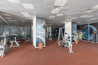 a gym with treadmills and exercise equipment in a building at HAVN -1 Bedroom Apartment with Dubai Marina View in Dubai