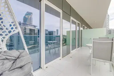 a room with large windows and a view of the city at GlobalStay Reva & Vera Residences Business Bay Apartments in Dubai