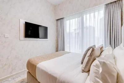a bedroom with a bed with a large window at GlobalStay Reva & Vera Residences Business Bay Apartments in Dubai