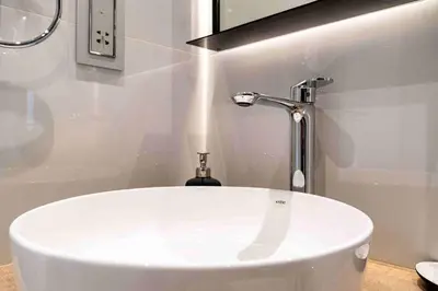 a white sink with a faucet in a bathroom at Veluxa - Fantastic 1 Bed - in Jumeirah Golf Estate! in Dubai