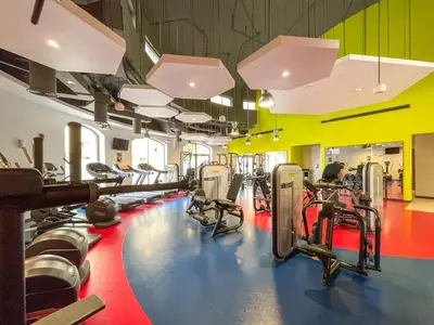 a gym with lots of treadmills and machines at Beautiful 2 Bedroom Retreat in the Heart of JBR in Dubai
